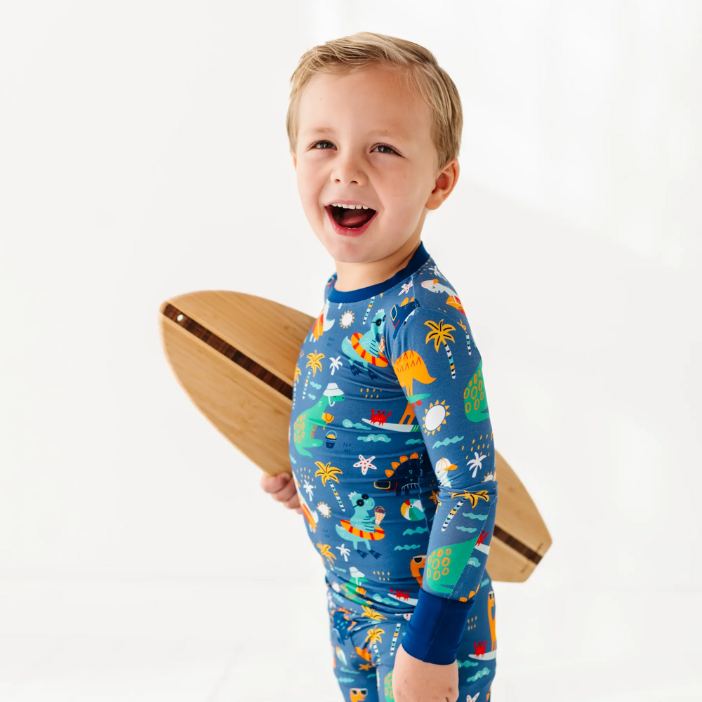 
                      
                        Blue dinosaur bamboo pajamas by Kiki and Lulu
                      
                    