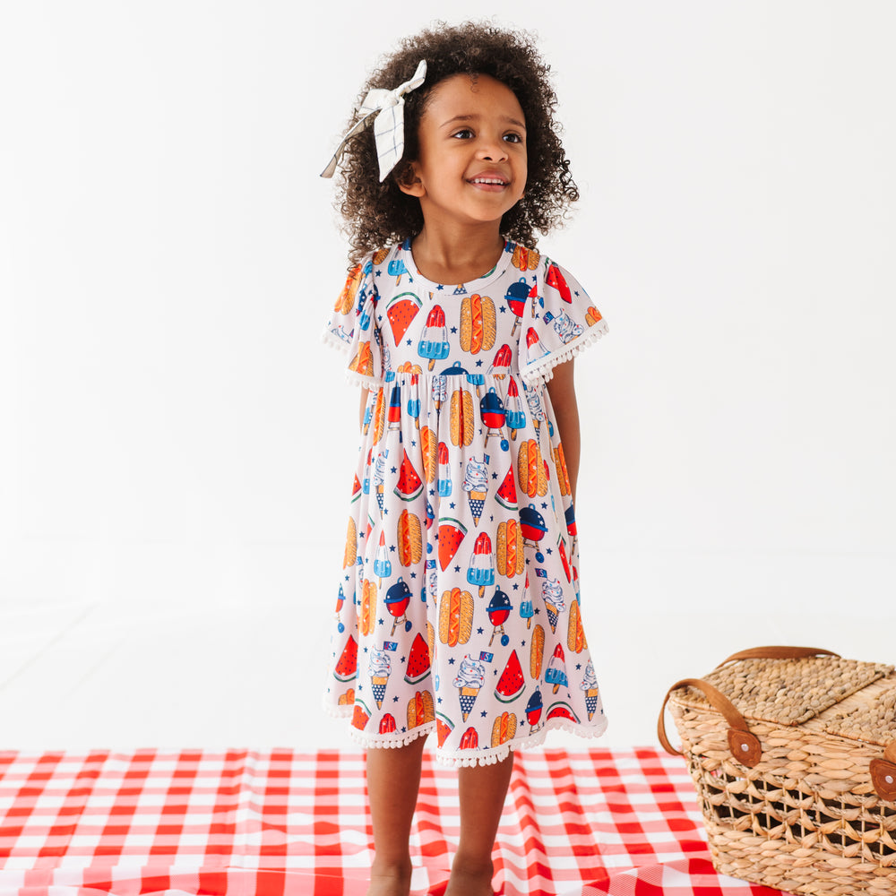 
                      
                        Red, White & BBQ Pom Pom Dress
                      
                    
