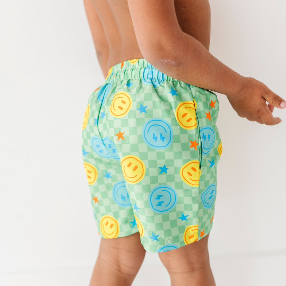 
                      
                        Electric Smiles Swim Trunks
                      
                    