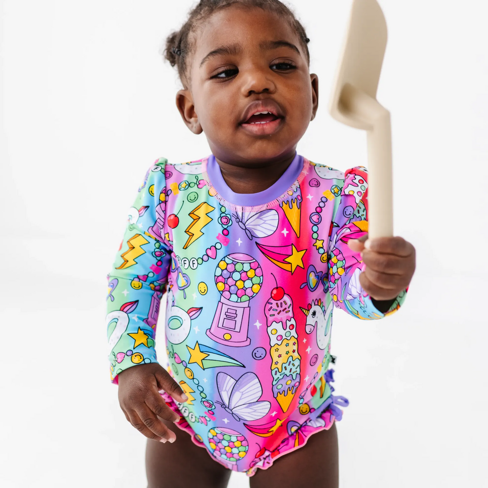 
                      
                        Cosmic Candyland Long Sleeve Ruffle Swimsuit
                      
                    