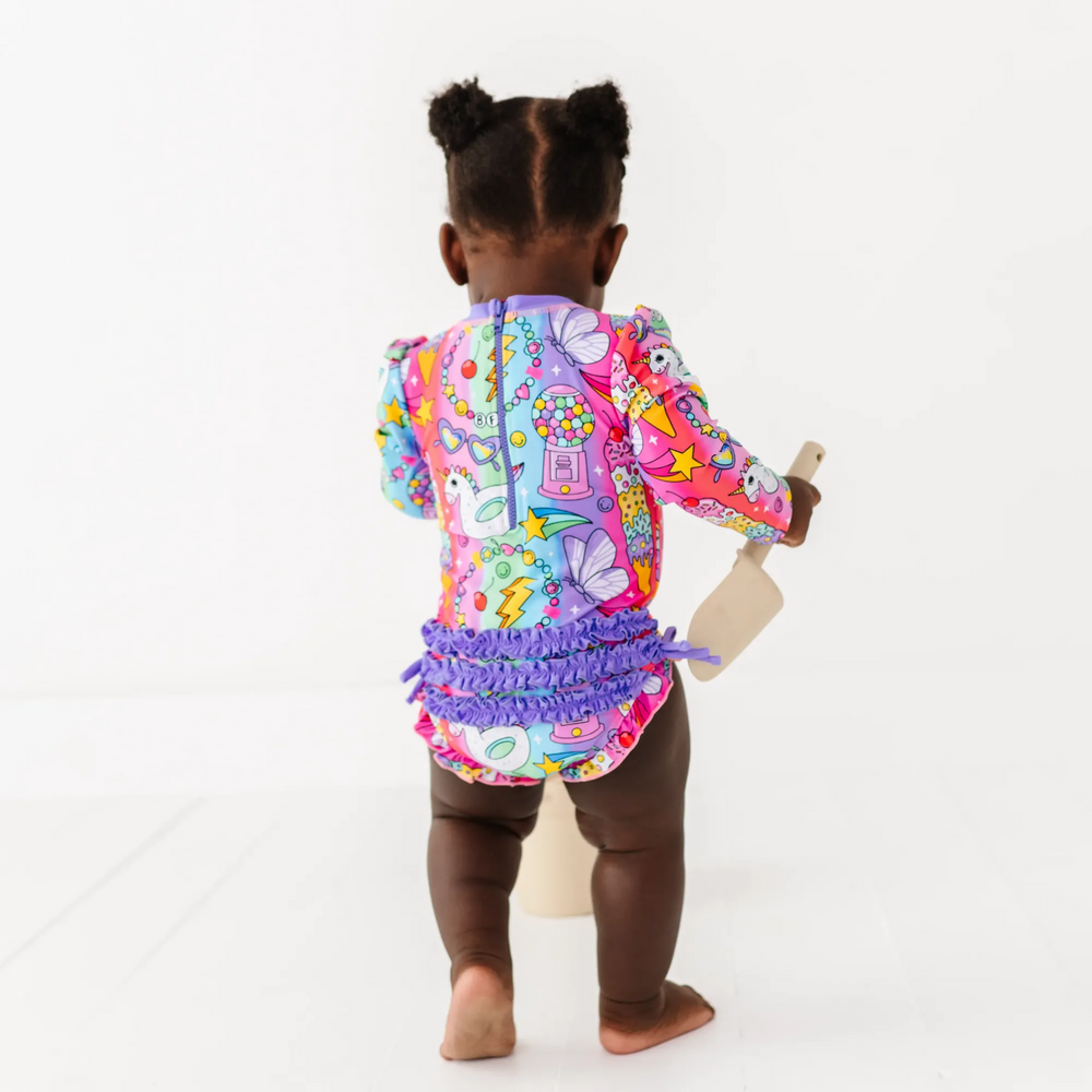 
                      
                        Cosmic Candyland Long Sleeve Ruffle Swimsuit
                      
                    