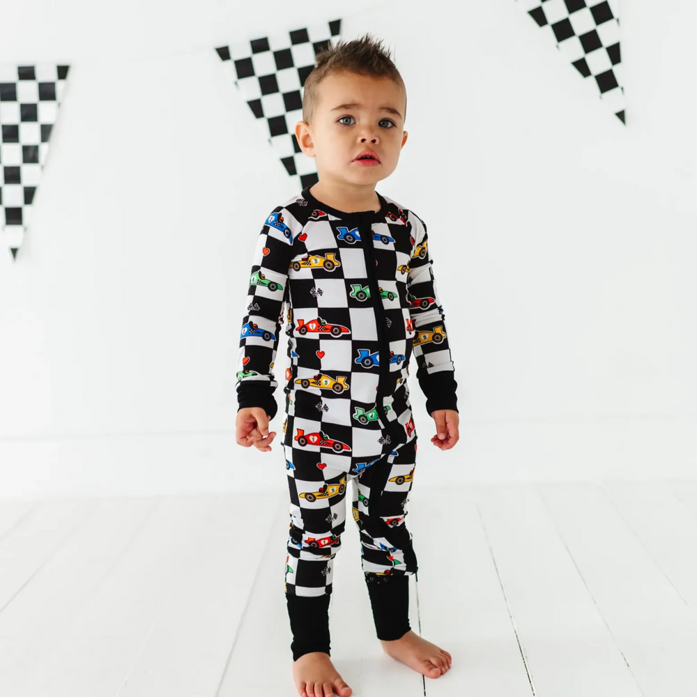 
                      
                        Kid in Racecar checkered footies by Kiki and Lulu
                      
                    