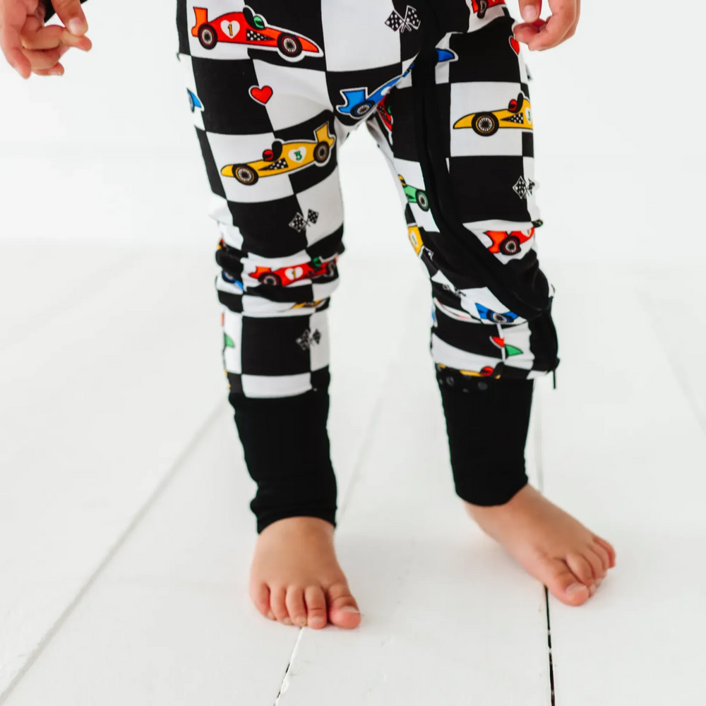 
                      
                        Kid in Racecar checkered footies by Kiki and Lulu
                      
                    