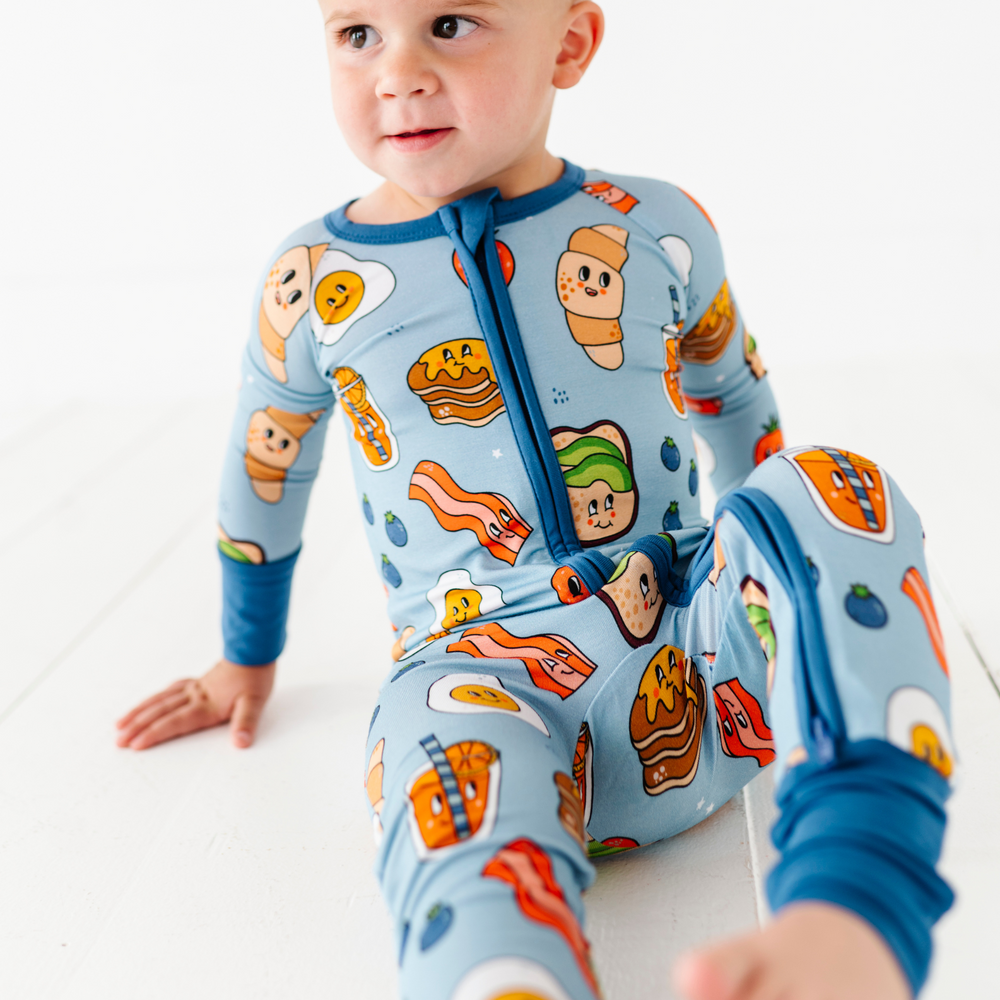 
                      
                        Baby in blue breakfast pajamas
                      
                    