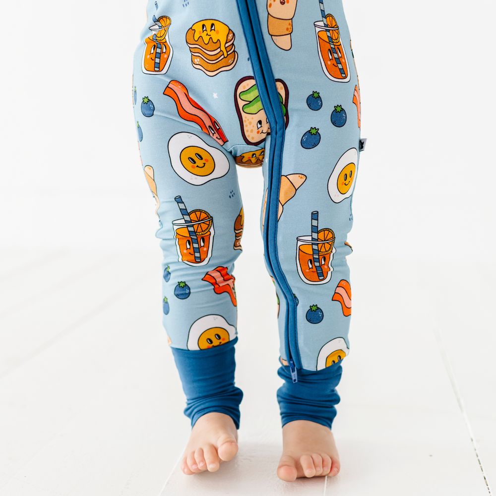 
                      
                        Baby in blue breakfast pajamas
                      
                    