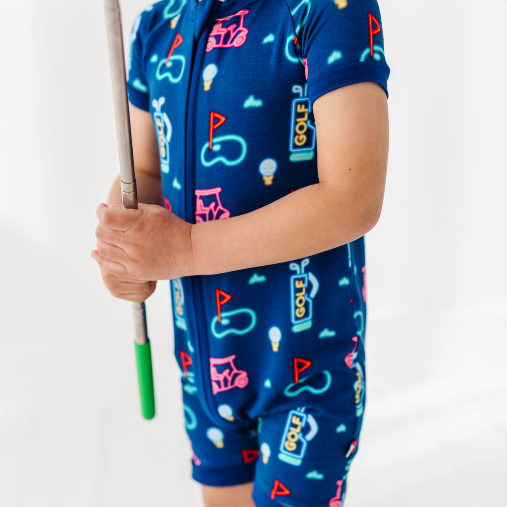 
                      
                        Boy In Neon Golf Shorties 
                      
                    