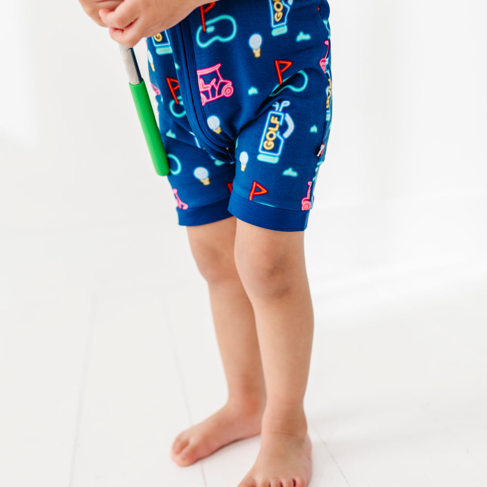 
                      
                        Boy In Neon Golf Shorties 
                      
                    