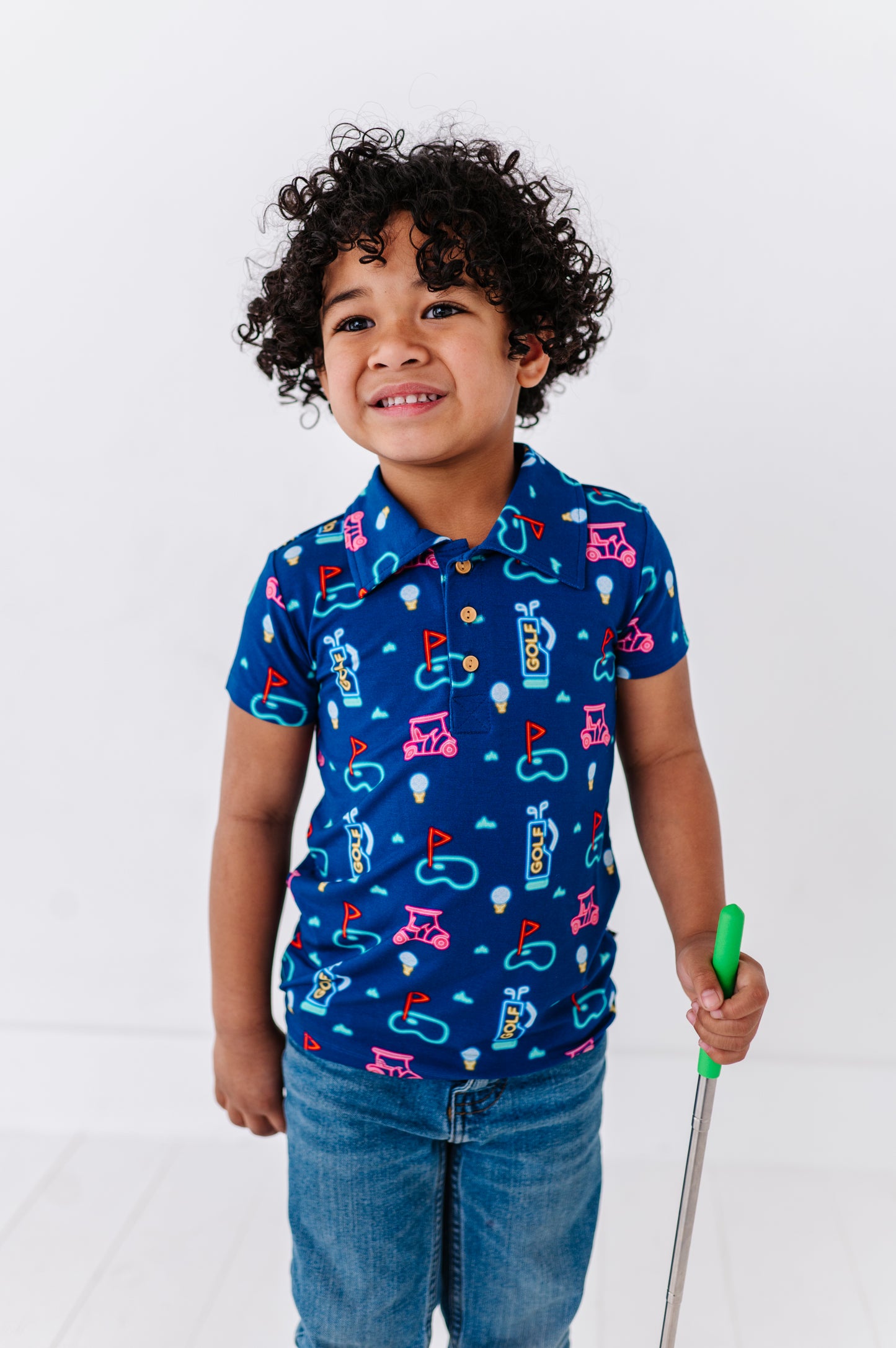 Boy Sporting Neon Golf Polo By Kiki and Lulu