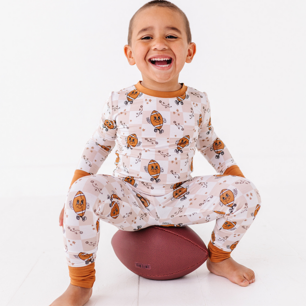 Boy Wearing Football Pajamas