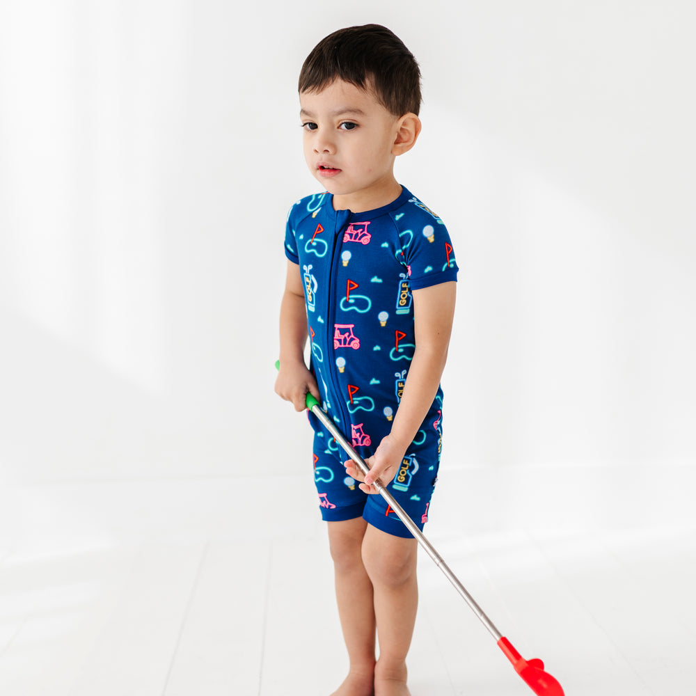 
                      
                        Boy Wearing Neon Golf Shorties by Kiki and Lulu
                      
                    