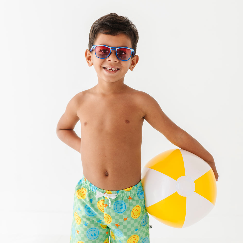 
                      
                        Boy rocking Neon Smiley Swim Shorts
                      
                    
