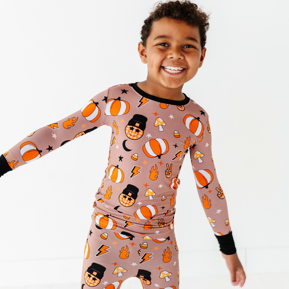 
                      
                        Boy wearing retro pumpkin pajamas by Kiki and Lulu
                      
                    