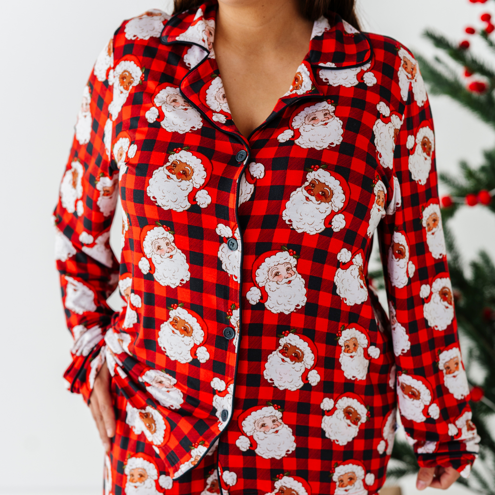 Woman wearing buffalo check santa pajamas by Kiki and Lulu