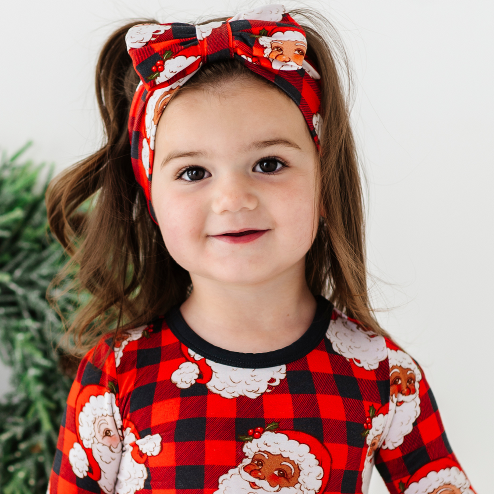 Girl in Santa bow by Kiki and Lulu