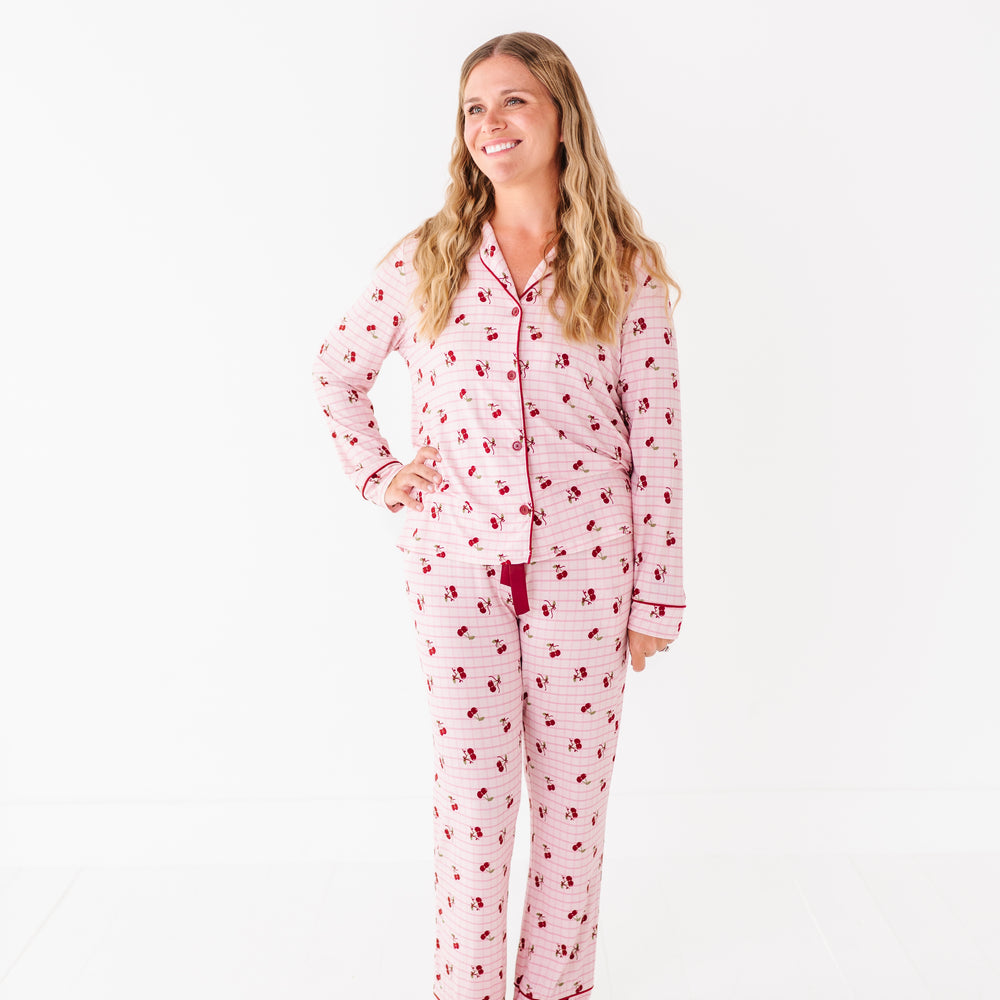 
                      
                        Woman wearing a pink pajama set with a white background
                      
                    