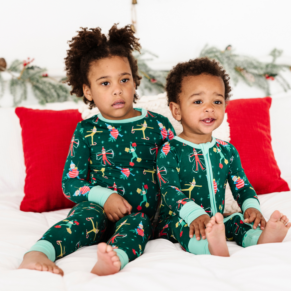 Toddler in elf on the shelf pajamas by Kiki and Lulu