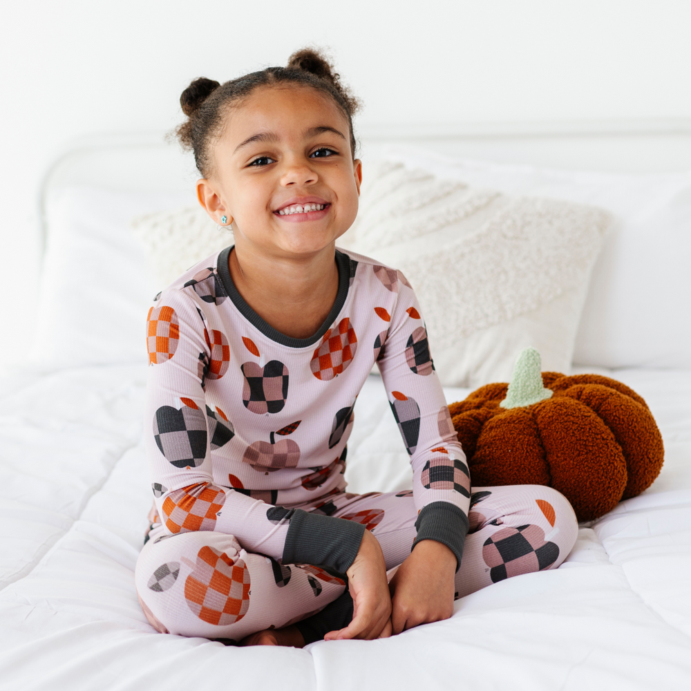 
                      
                        Girl Wearing Fall Apple Kids Pajamas
                      
                    