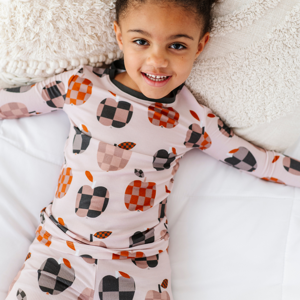 
                      
                        Girl Wearing Fall Apple Kids Pajamas
                      
                    