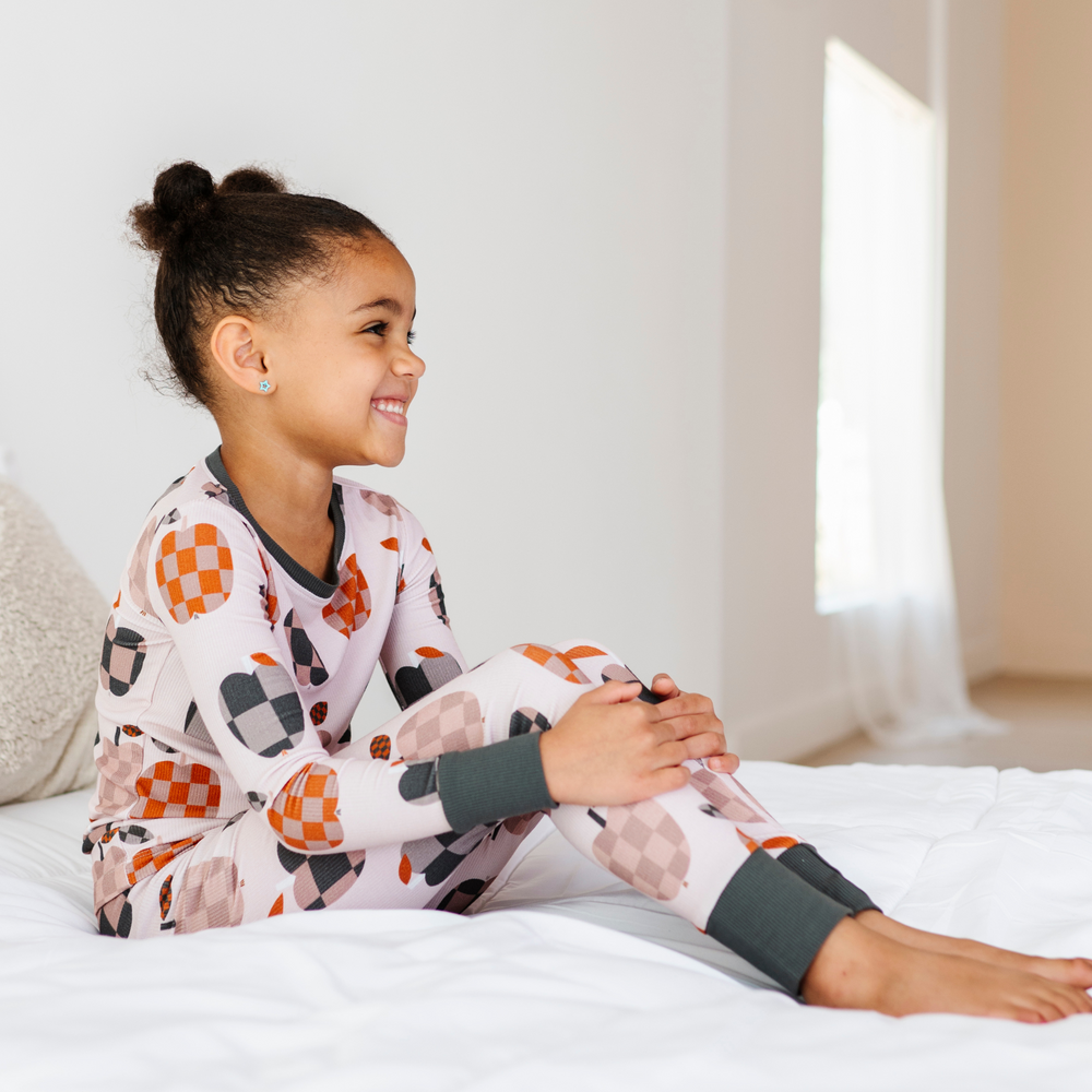 
                      
                        Girl Wearing Fall Apple Kids Pajamas
                      
                    