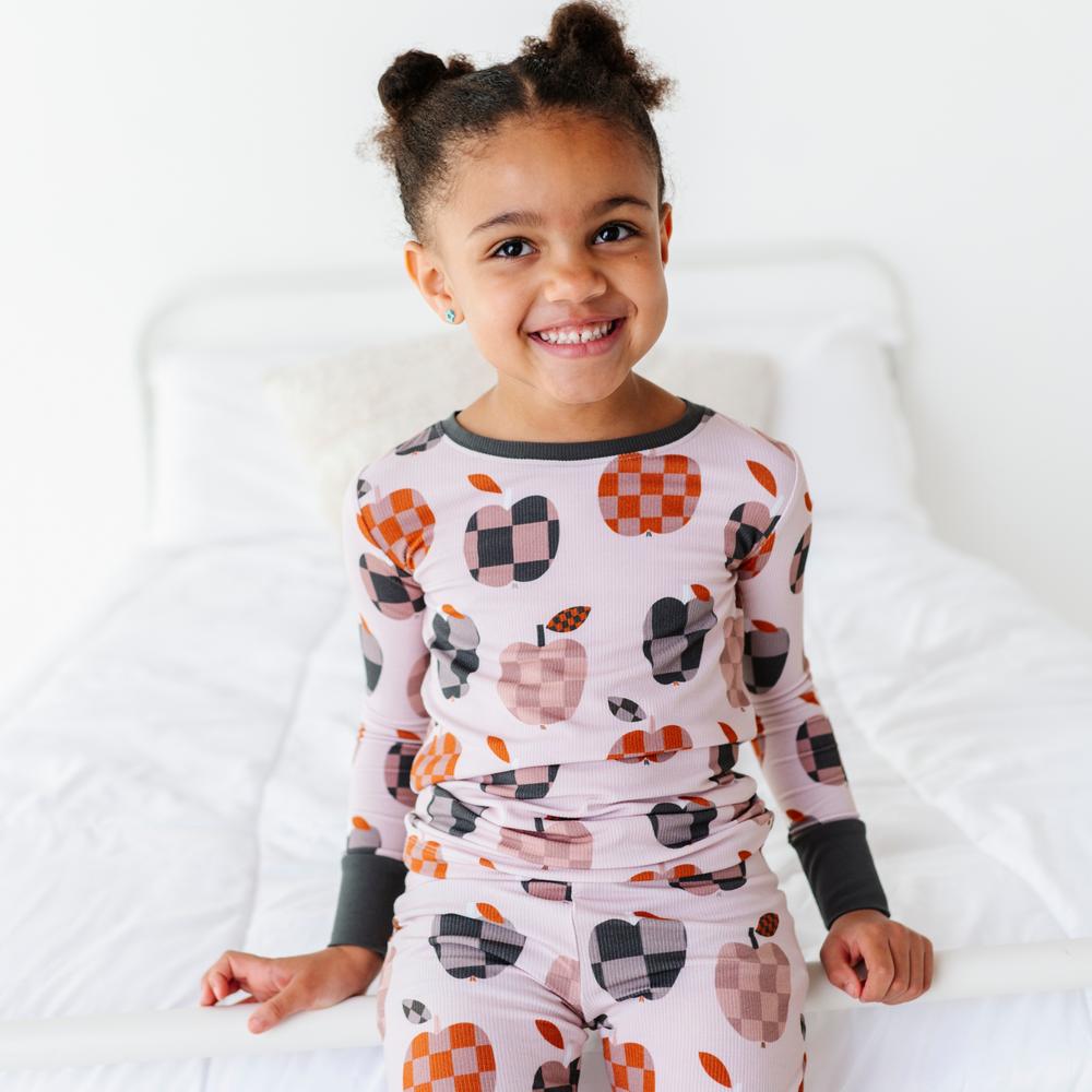 
                      
                        Girl Wearing Fall Apple Kids Pajamas
                      
                    