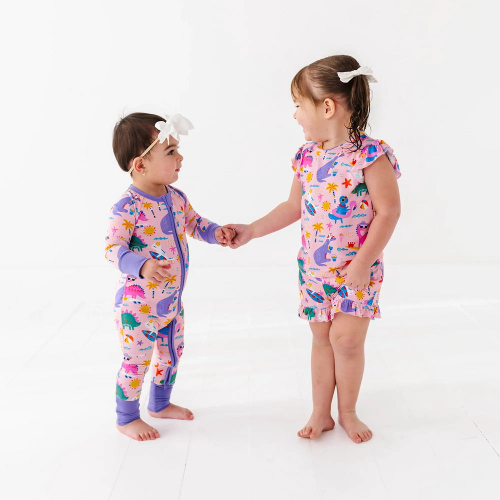 
                      
                        Girl in short pajama dinosaur set by Kiki and Lulu
                      
                    