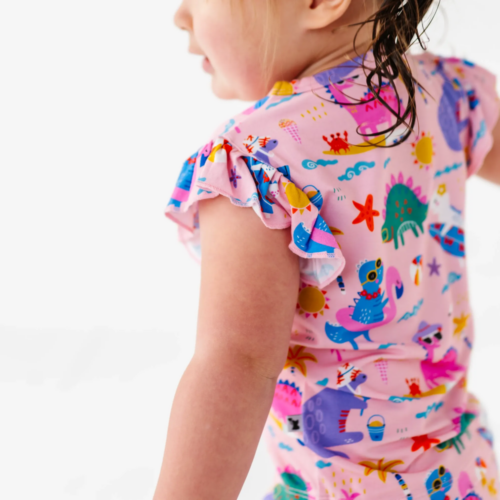 
                      
                        Girl in short pajama dinosaur set by Kiki and Lulu
                      
                    