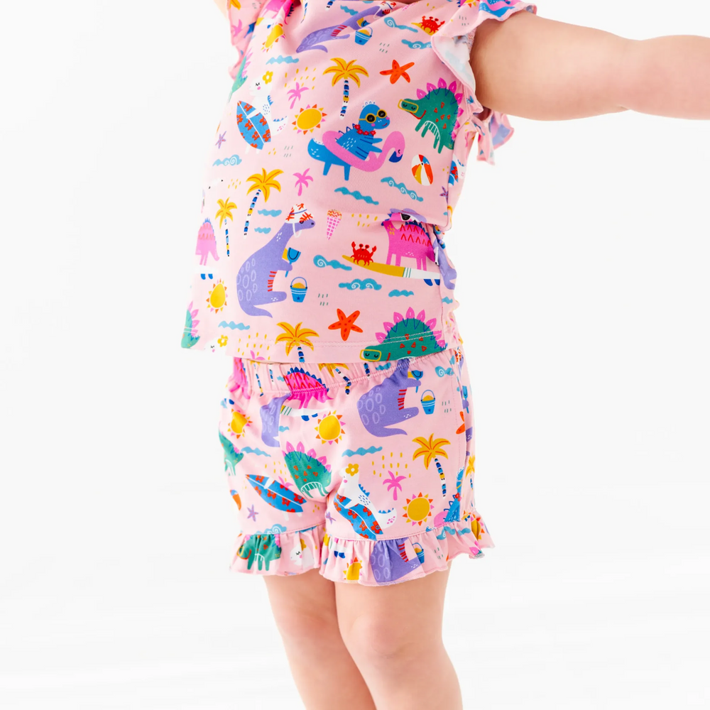 
                      
                        Girl in short pajama dinosaur set by Kiki and Lulu
                      
                    