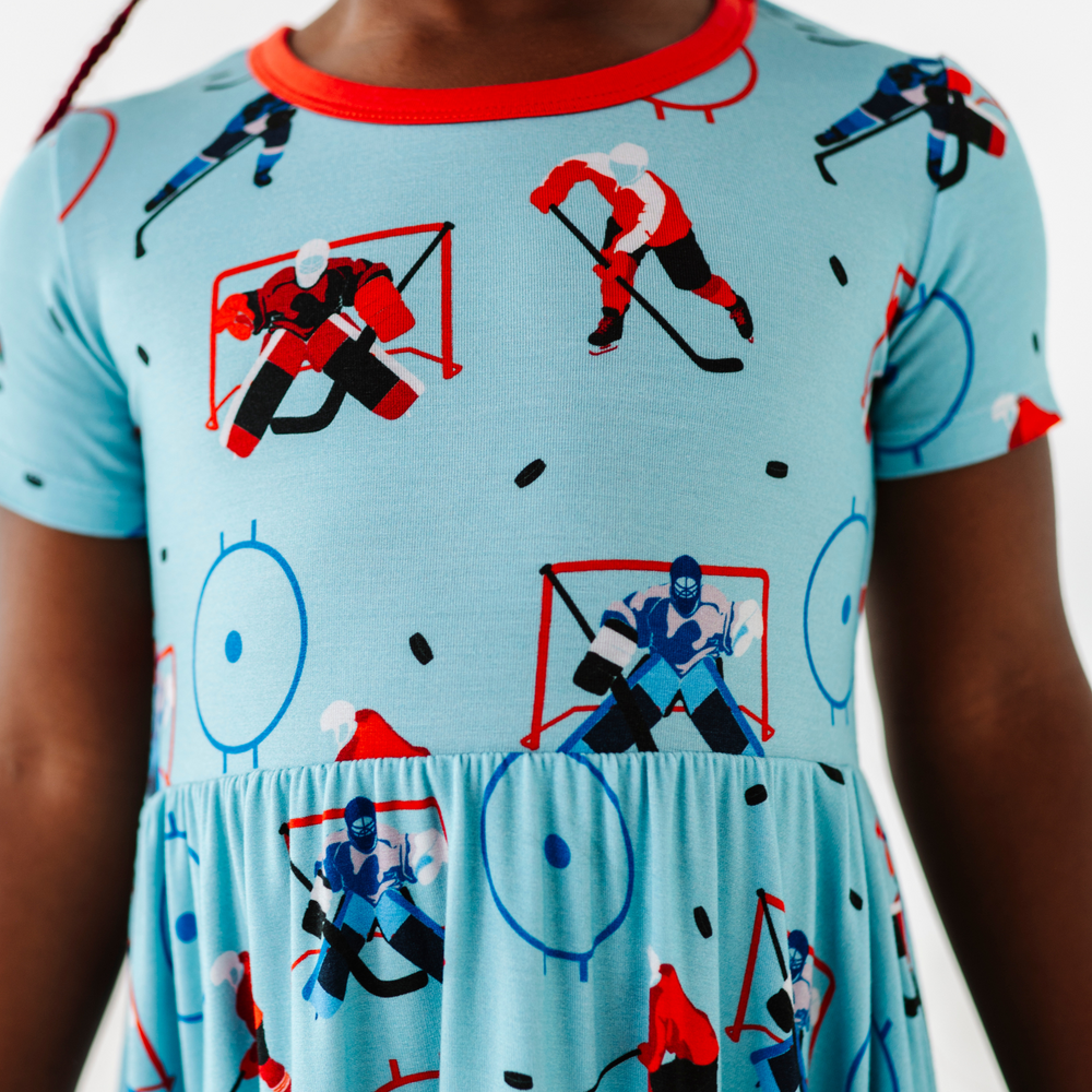 Girl wearing hockey dress by Kiki and Lulu