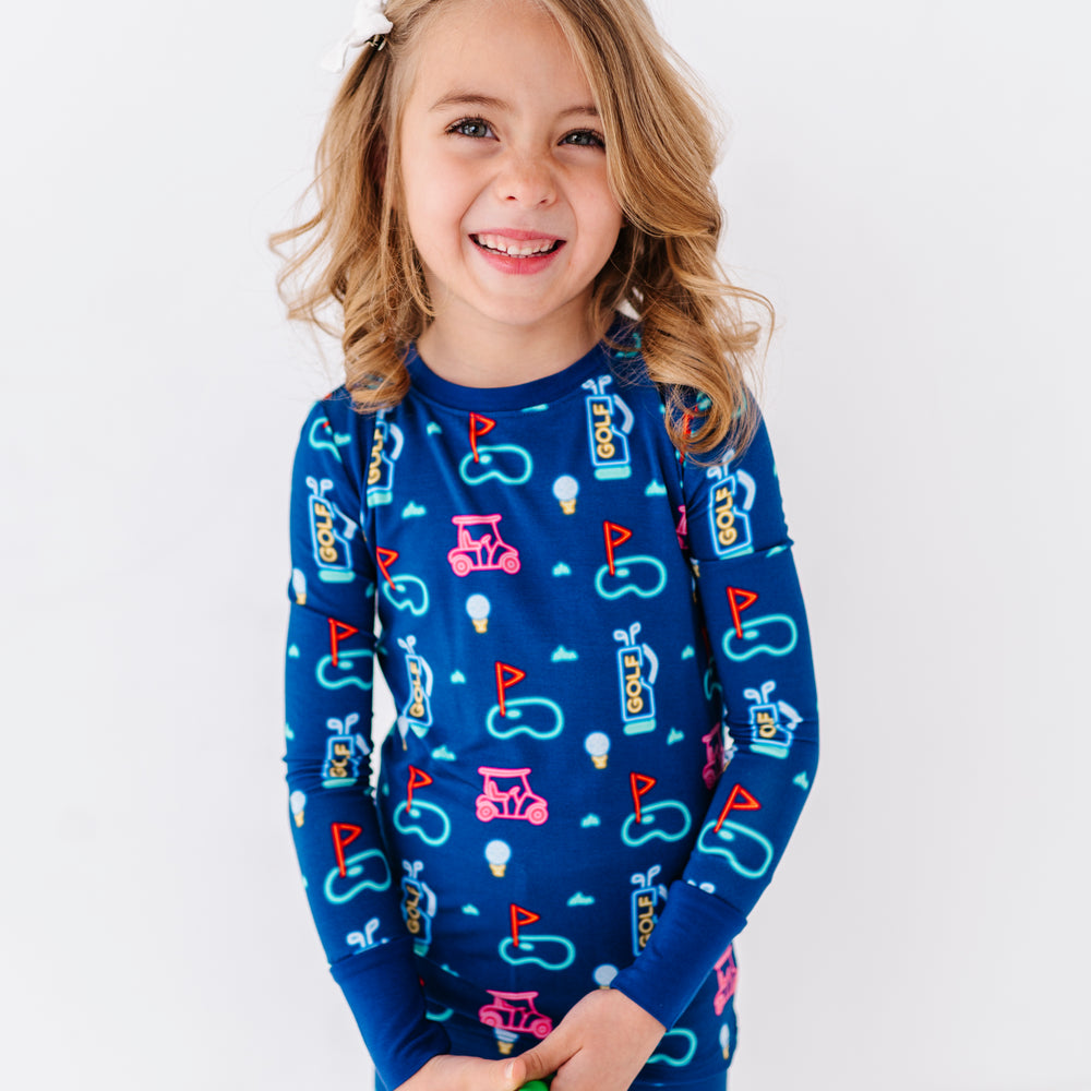 
                      
                        Girl Rocking Neon Golf Pajamas by Kiki and Lulu
                      
                    