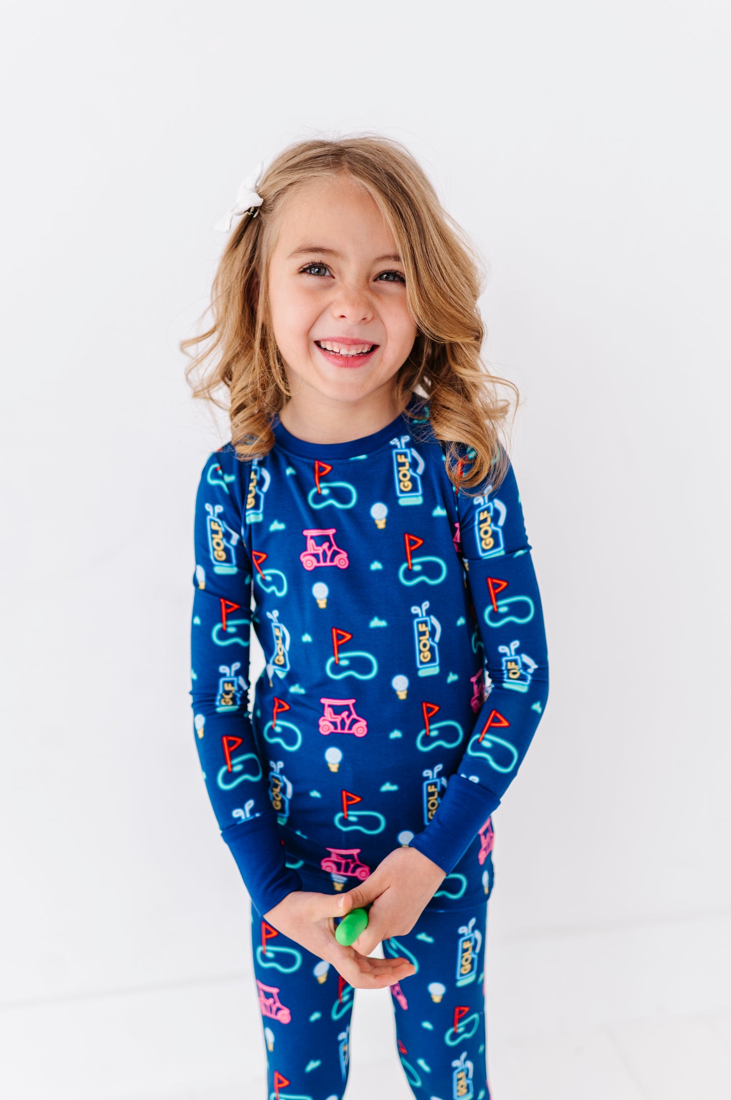 Girl Rocking Neon Golf Pajamas by Kiki and Lulu