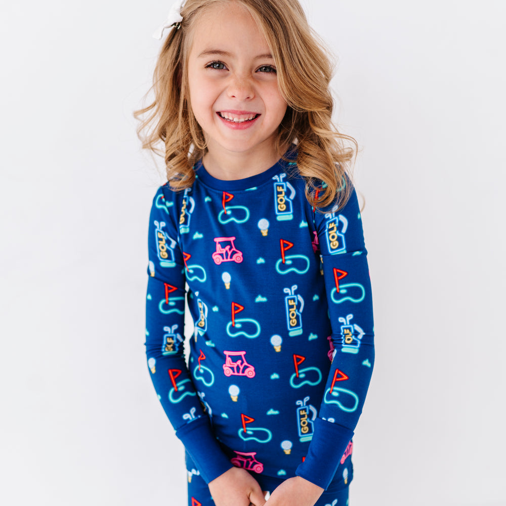 
                      
                        Girl Sporting Neon Golf Pajamas by Kiki and Lulu
                      
                    