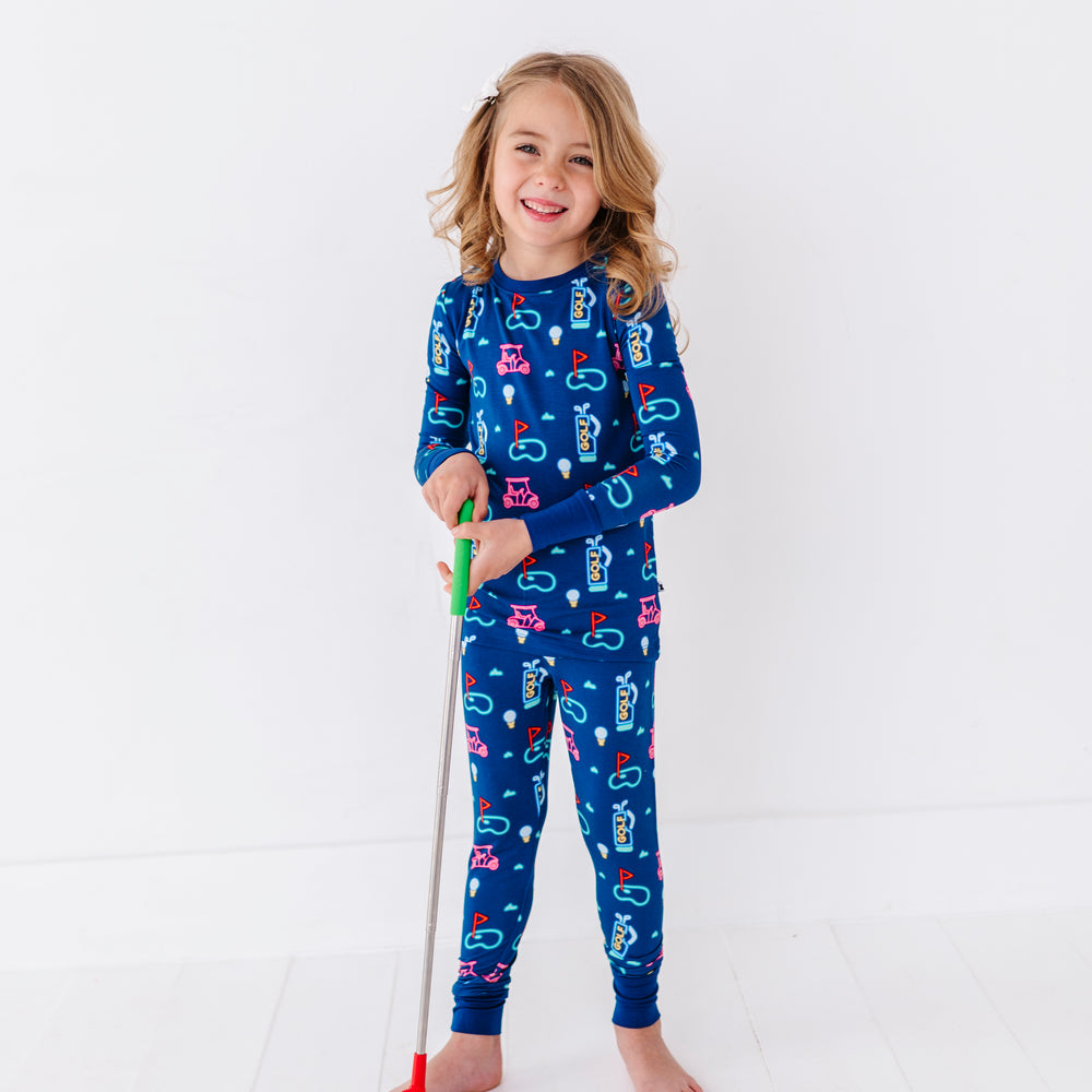 
                      
                        Girl Wearing Neon Golf Pajamas by Kiki and Lulu
                      
                    