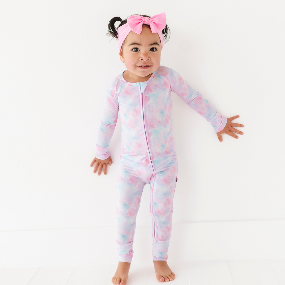 Girl in tie dye convertible footies by Kiki and Lulu