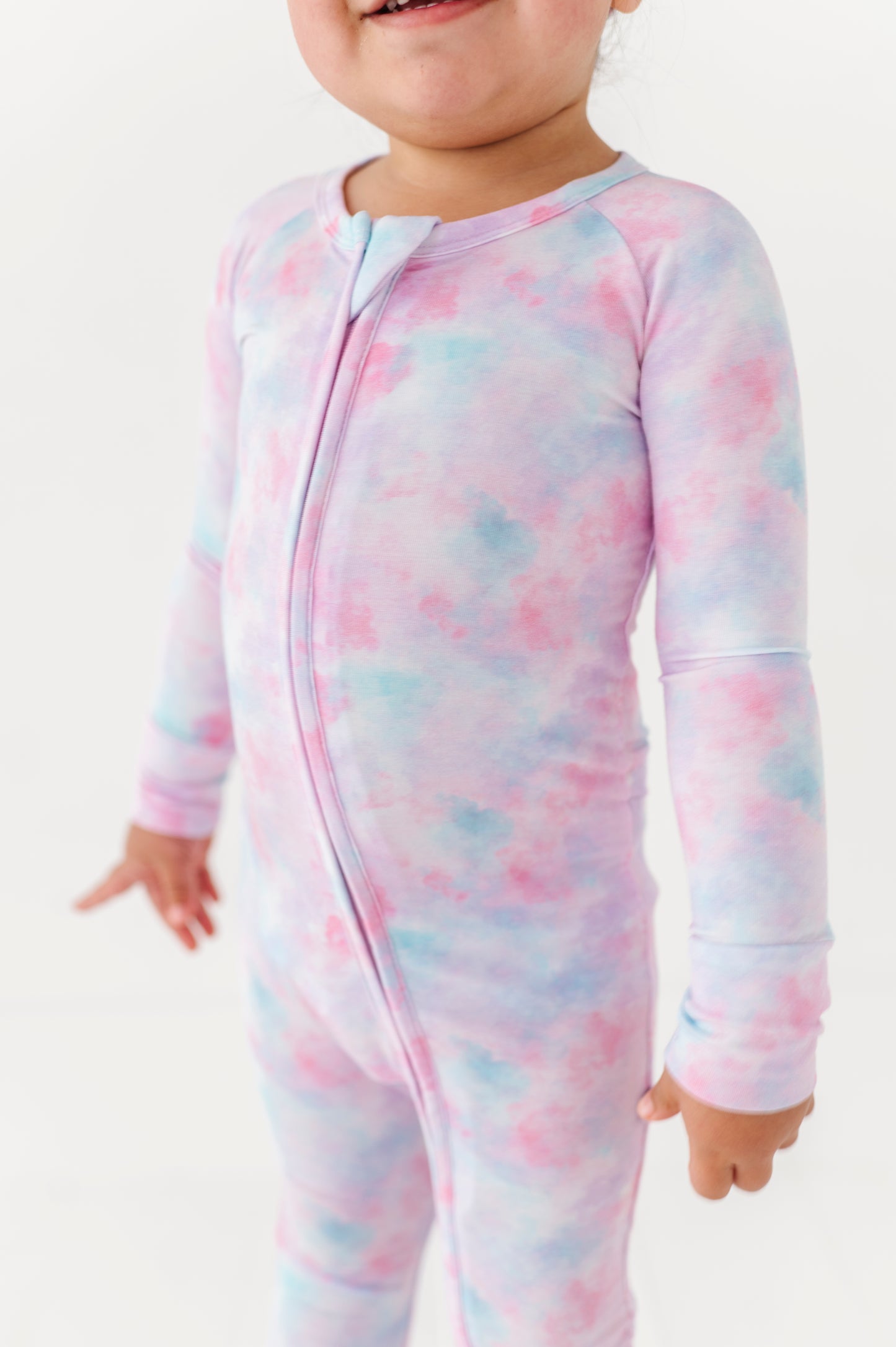 Girl in tie dye convertible footies by Kiki and Lulu