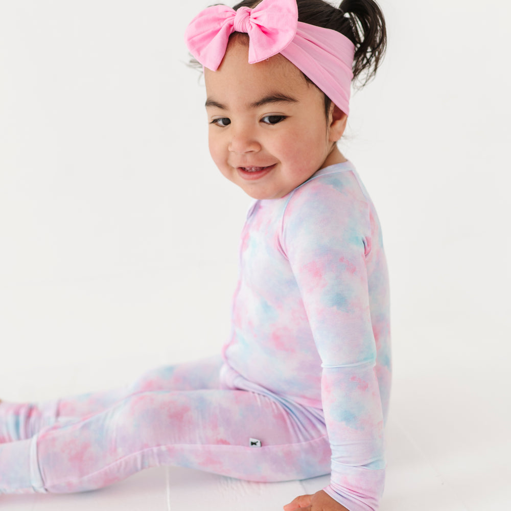 
                      
                        Girl in tie dye convertible footies by Kiki and Lulu
                      
                    