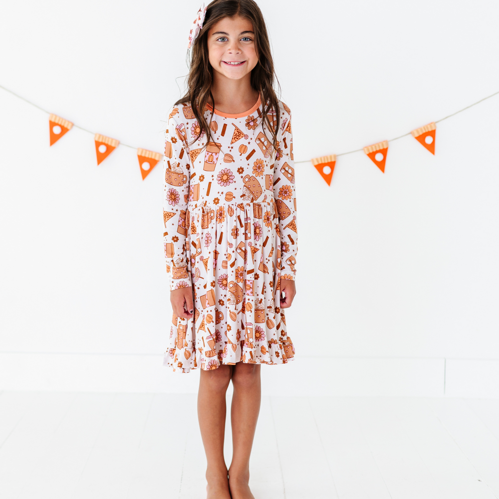 
                      
                        Girl in Pumpkin Spice Latte Dress by Kiki and Lulu
                      
                    