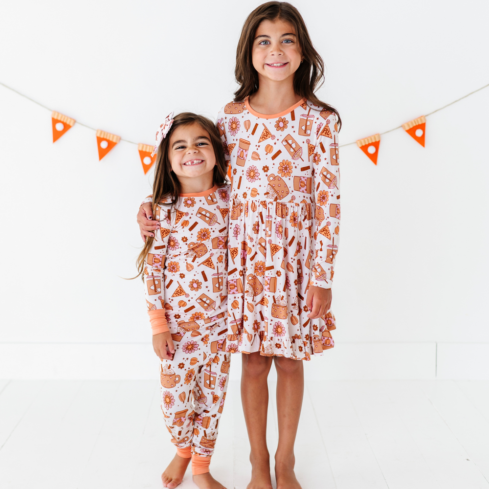 
                      
                        Girl in Pumpkin Spice Latte Dress by Kiki and Lulu
                      
                    