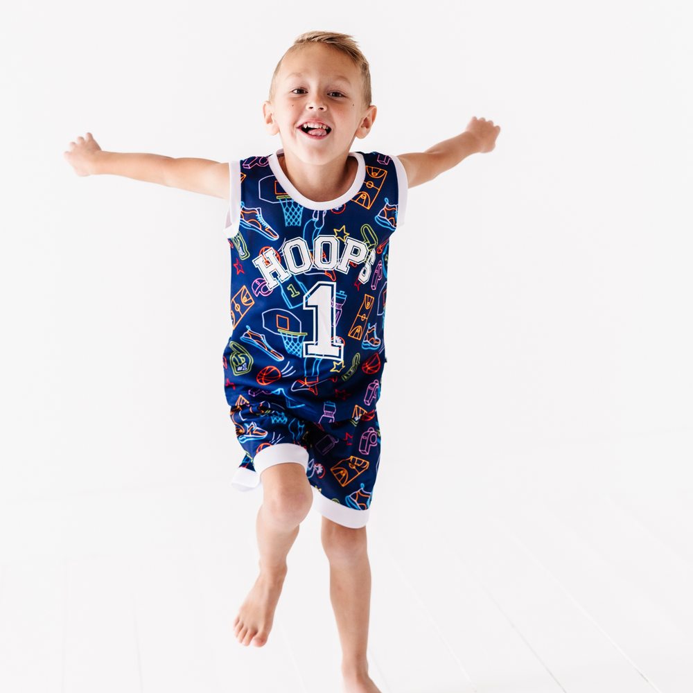 
                      
                        Boy in neon basketball jersey
                      
                    