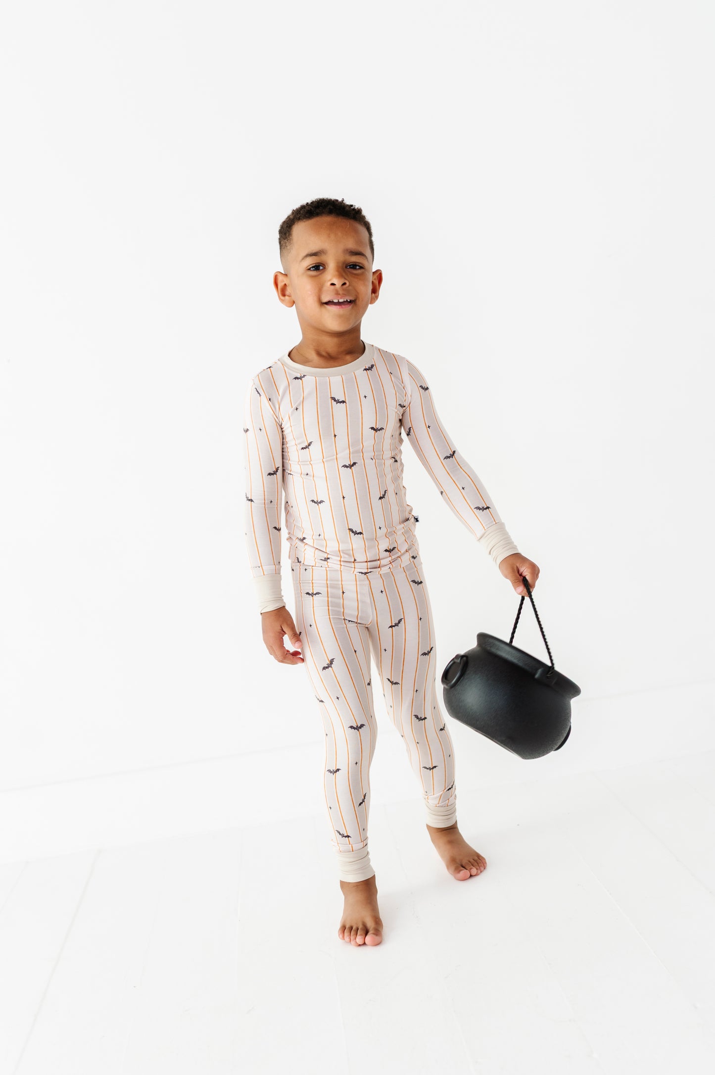 Kids Halloween PJs with bats for sibling matching and cozy memories