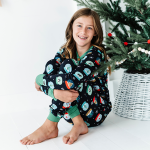 Girl in Kiki and Lulu Snow Globe Christmas Family Matching Pajamas 