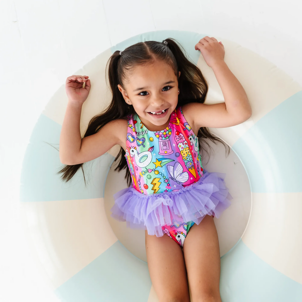 
                      
                        Cosmic Candyland Swimsuit With Tutu
                      
                    