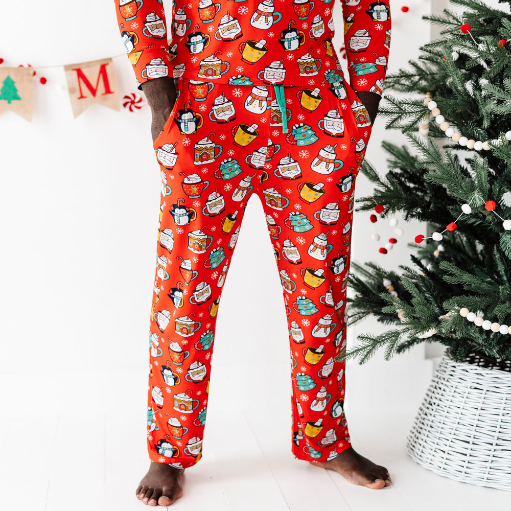 Man in family matching Christmas cocoa pajamas
