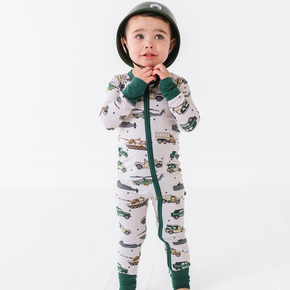 
                      
                        Boy rocking Military Vehicle Zip Pajamas
                      
                    