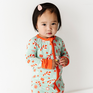 Baby in Mint footies by Kiki and Lulu