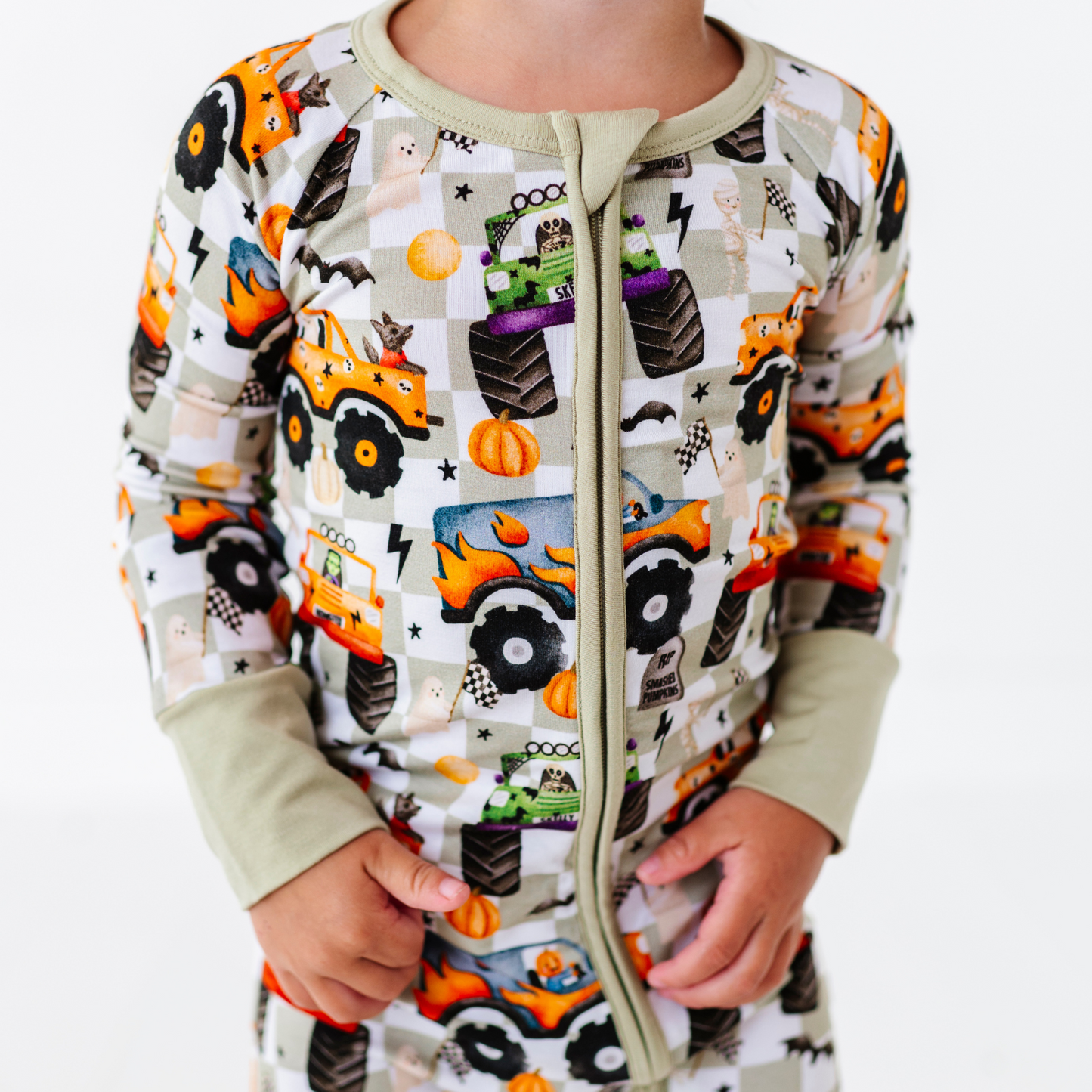 Boy in Halloween Monster Truck Pajamas by Kiki and Lulu