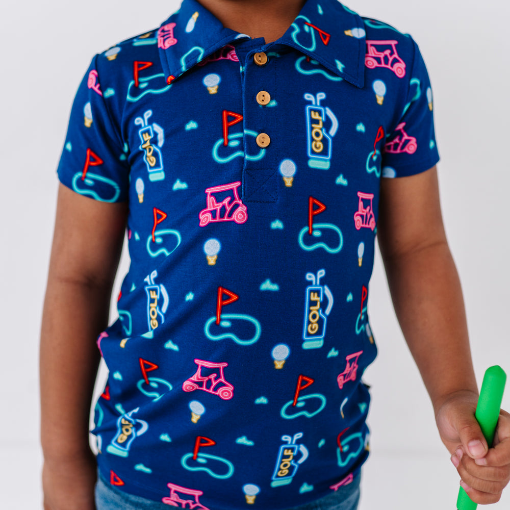 
                      
                        Boy In Neon Golf Polo By Kiki and Lulu
                      
                    