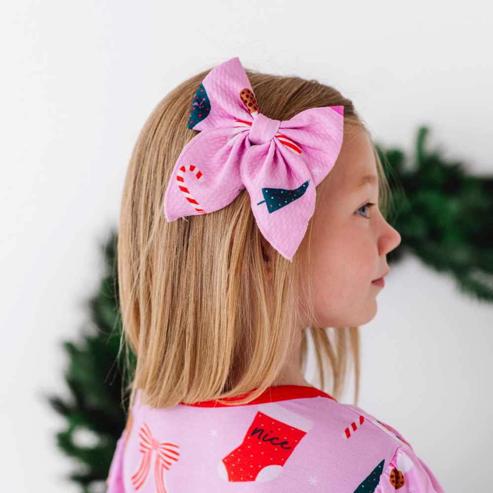 
                      
                        Girl in Pink Christmas Bow
                      
                    