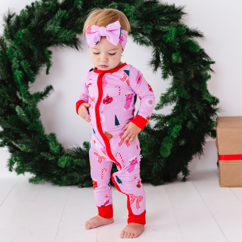 
                      
                        Baby in Pink Christmas pajamas by Kiki and Lulu
                      
                    