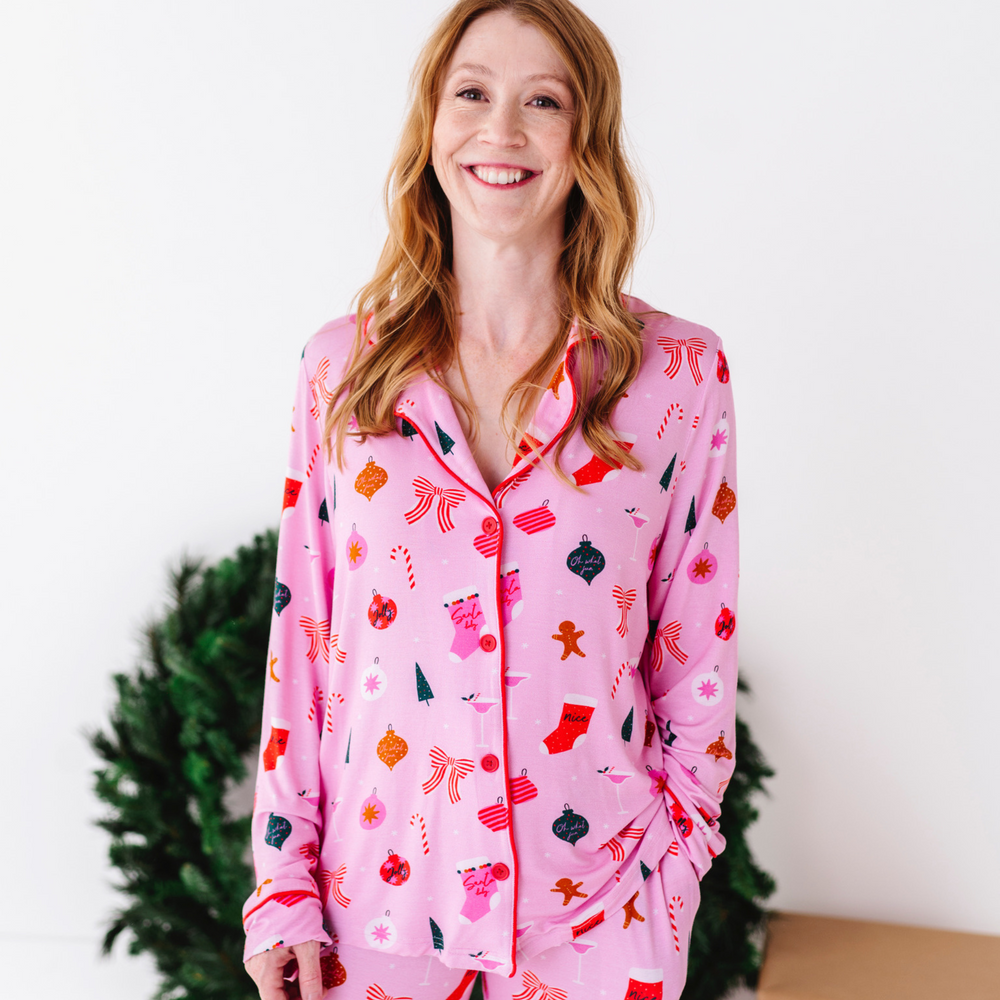 
                      
                        Woman in pink Christmas pajamas by Kiki and Lulu
                      
                    