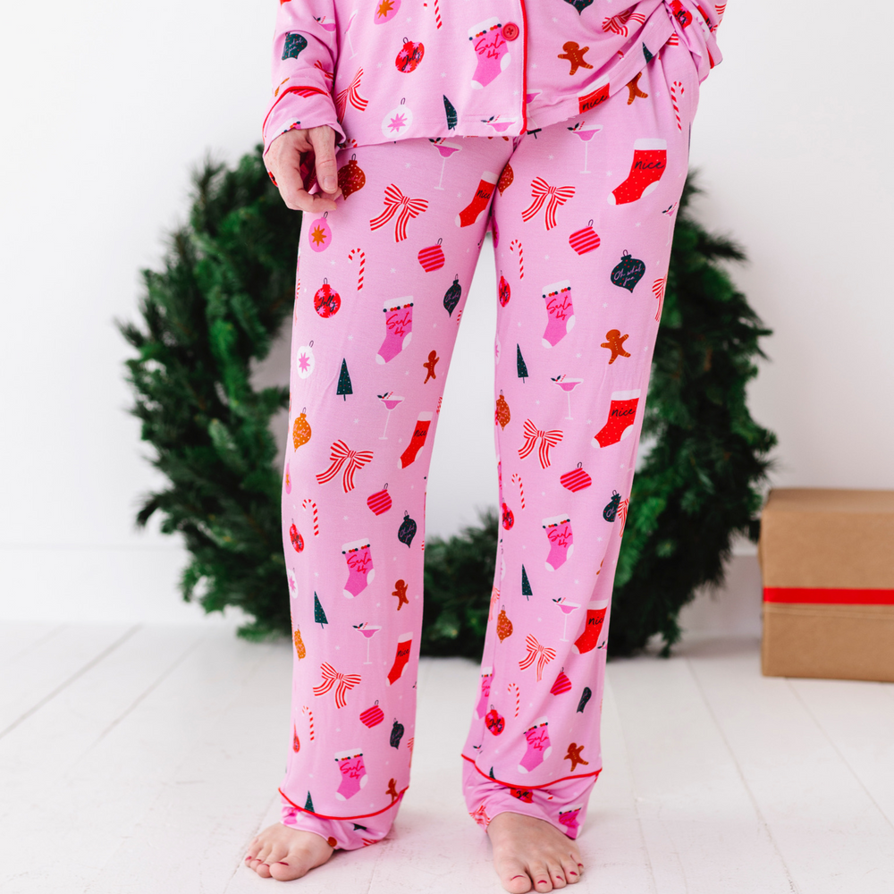 
                      
                        Woman in pink Christmas pajamas by Kiki and Lulu
                      
                    